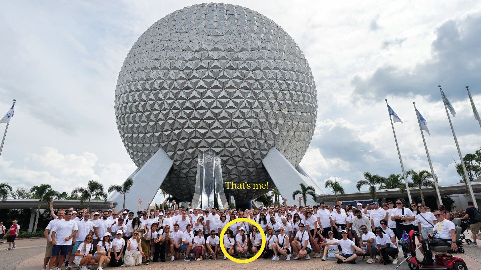 Photo of the Kustomer team in front of the Epcot ball with a yellow circle and "That's me" in front of the author of this newsletter