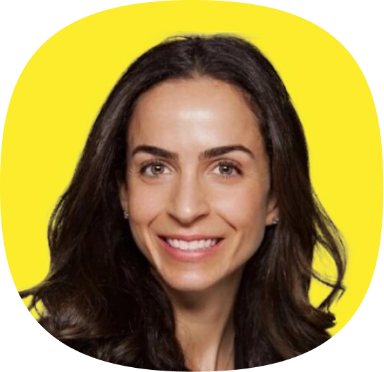 A woman with long dark hair and fair skin smiles at the camera, set against a bright yellow background, highlighting the vibrant energy of Kustomer Winter Quarterly AI Innovations.